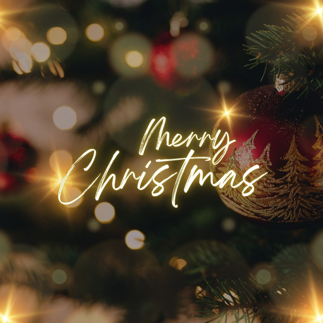 Red ornament on Christmas tree with warm lights, perfect for festive bathroom styling inspiration